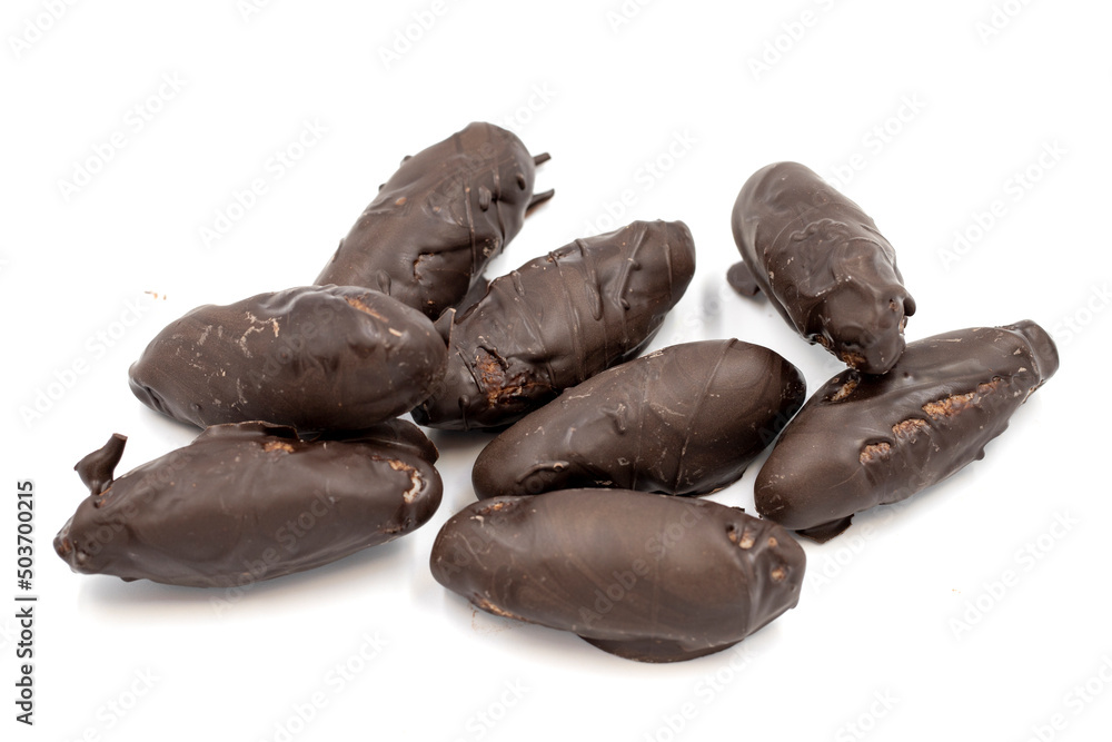 Special chocolate with dark outside and coconut inside. Dark chocolate with coconut filling on a white background. close up Special chocolate with dark outside and coconut inside. Dark chocolate with coconut filling on a white background. close up