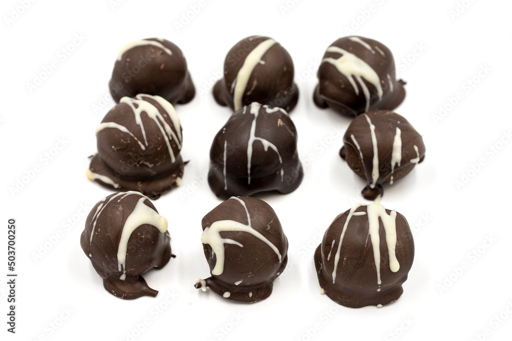 Special chocolate with dark outside and coconut inside. Dark chocolate with coconut filling on a white background. close up Special chocolate with dark outside and coconut inside. Dark chocolate with coconut filling on a white background. close up