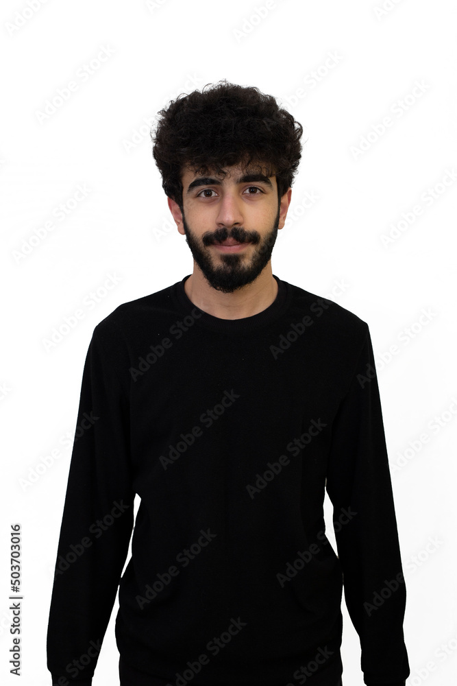 Fototapeta premium Curly haired young male in black sweater. Isolated on white background