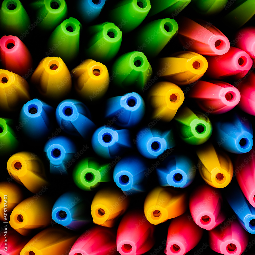 Fototapeta premium ballpoint pens in various bright colors. Top view of the caps.
