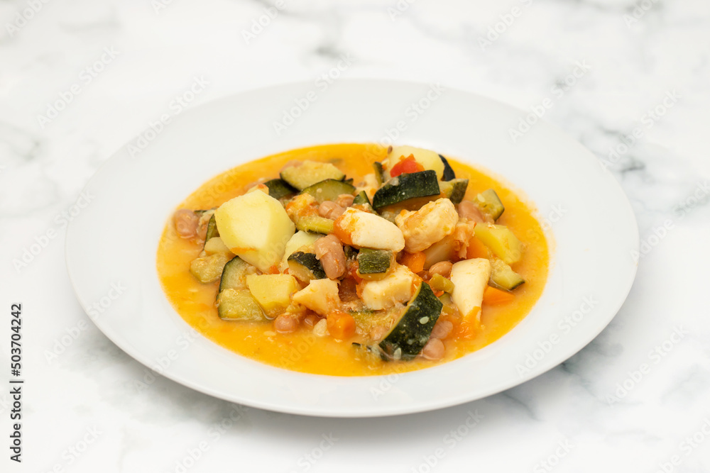 squid with with vegetables and sauce on the plate squid with with vegetables and sauce on the plate