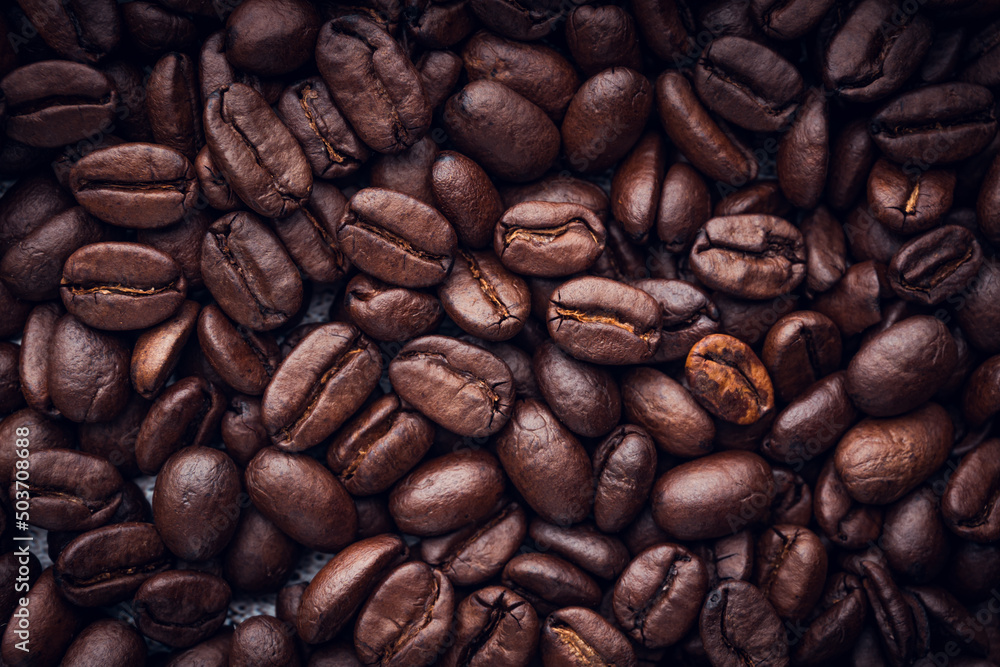 Fototapeta premium Roasted coffee beans background. Selective focus