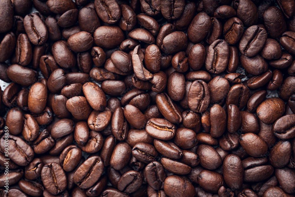 Roasted coffee beans background. Selective focus Roasted coffee beans background. Selective focus