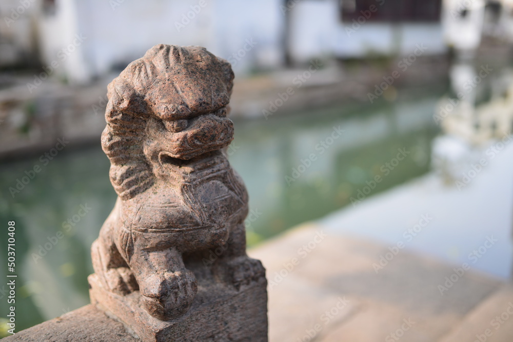 Statue of a Stone Lion in Zhouzhuang Water Town, China Statue of a Stone Lion in Zhouzhuang Water Town, China