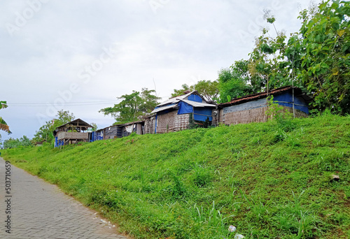 old wooden house on a small hill