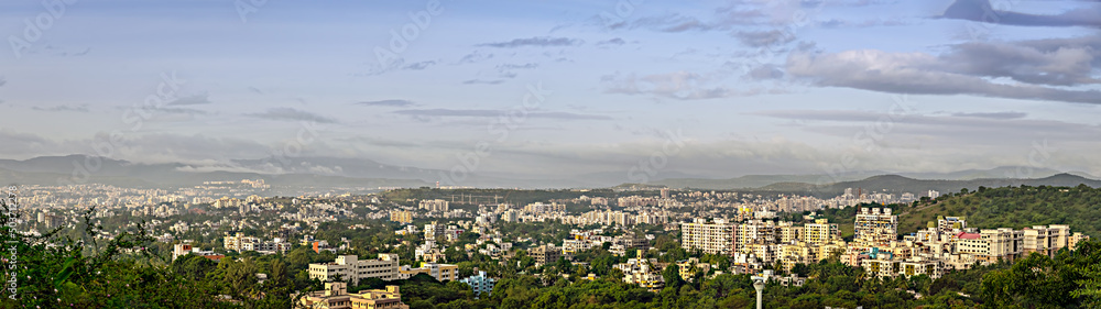 Early morning panorama image of fast developing city with many tall buildings and nice blue sky background. Early morning panorama image of fast developing city with many tall buildings and nice blue sky background.