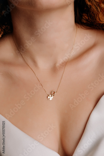 stylish elegant gold necklace on young girl's neck