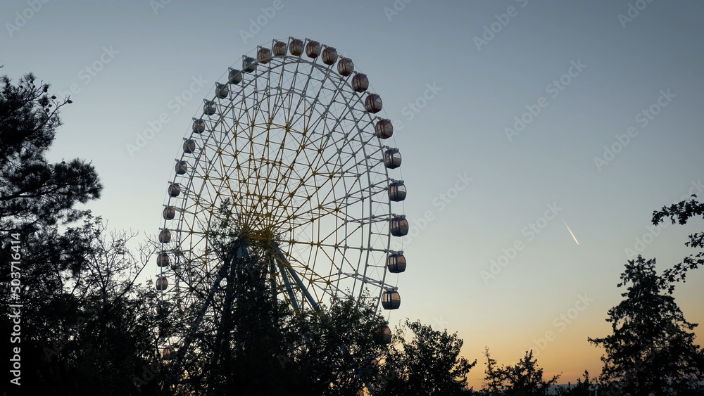 Ferris wheel. Observation wheel in the evening.