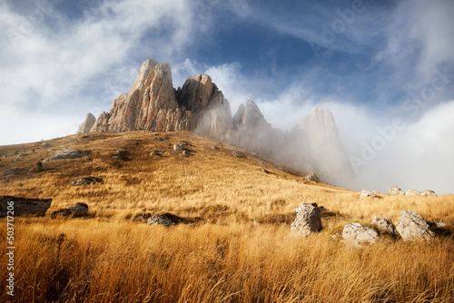 Morning dawn after rain with fog on the alpine stone wastelands of the Caucasus mountains. stone castle. Adygea. Russia