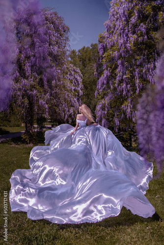 Beautiful woman in wisteria photoshoot