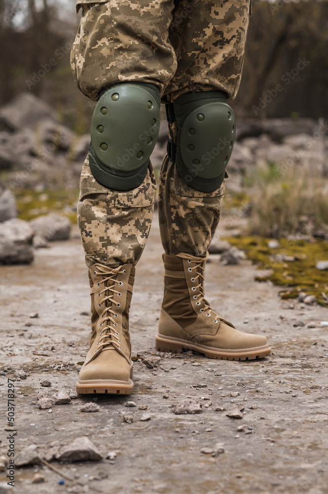 A soldier shod in special tactical khaki shoes A soldier shod in special tactical khaki shoes