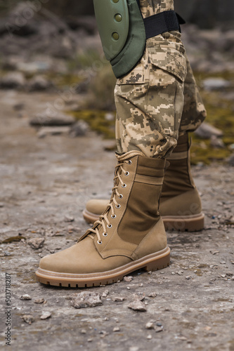 A soldier shod in special tactical khaki shoes