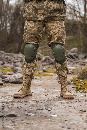 A soldier shod in special tactical khaki shoes