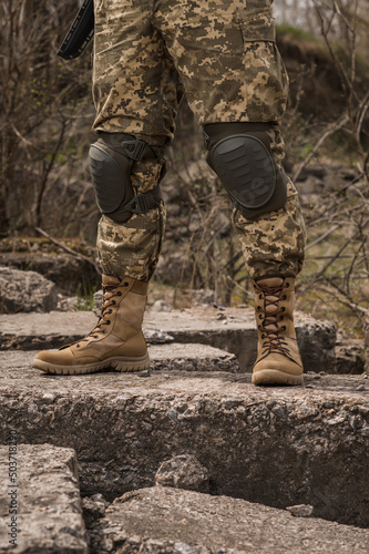 A soldier shod in special tactical khaki shoes