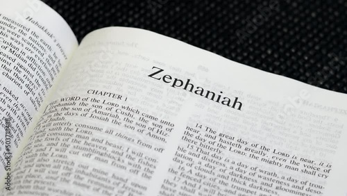 Close Up Shot of  Bible Page Turning to the book of Zephaniah photo