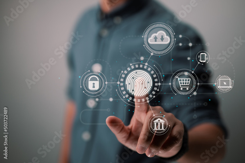 Online transactions, a businessman's fingerprint scan provides a secure interface for payment shopping banking and cloud computing network connection on a virtual display.