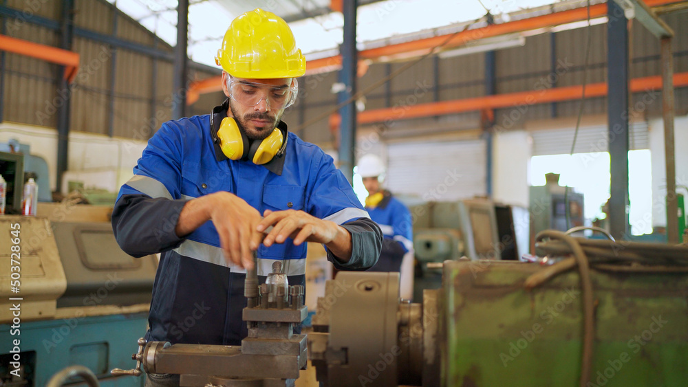 Factory engineer checking or maintenance machine. Wearing safety helmet and glasses to prevent accident. Worker inspector equipment and repair. Industrial, inspector and technology concept Factory engineer checking or maintenance machine. Wearing safety helmet and glasses to prevent accident. Worker inspector equipment and repair. Industrial, inspector and technology concept