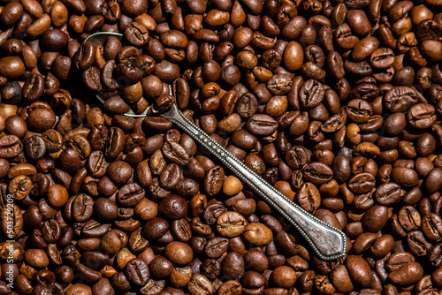 Coffee beans in full screen. Wallpaper from coffee beans. Texture of coffee beans