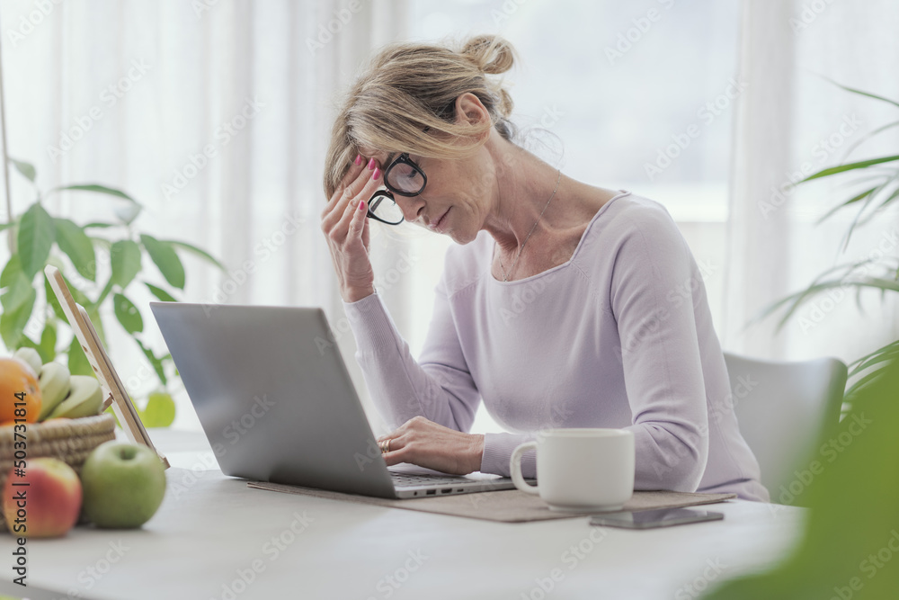 Tired woman working from home Tired woman working from home