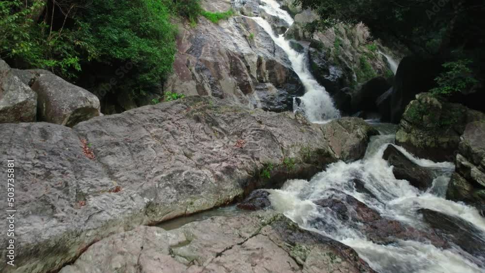 Flight over beautiful Hin Lad waterfall in Ko Samui, Thailand. Beautiful natural rainforest landscape Flight over beautiful Hin Lad waterfall in Ko Samui, Thailand. Beautiful natural rainforest landscape