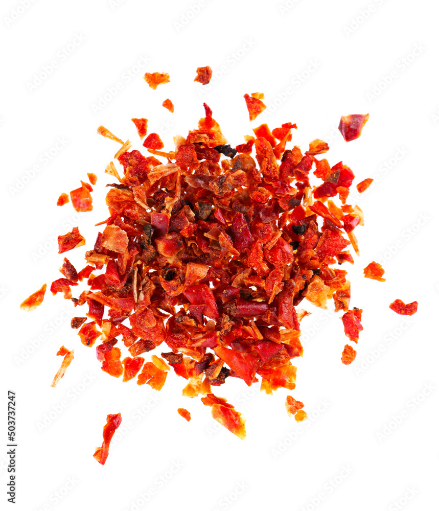 Naklejka premium Dried red paprika flakes isolated on white background. Spices and herbs. Top view.