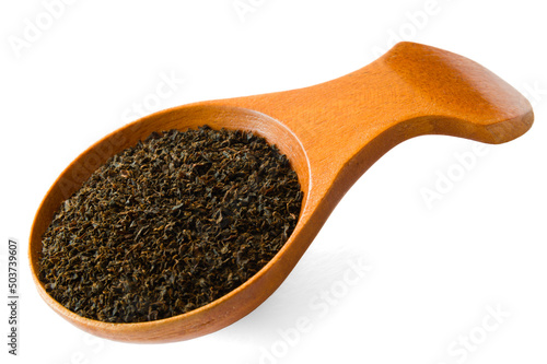 Fotografie Isolated wooden spoon with Ceylon BOP broken orange pekoe tea on white backgroun