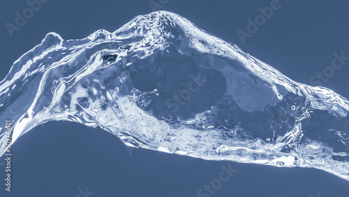 Water splash on a blue background. Reflection on the surface of the water.
