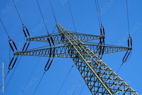 Wallpaper Mural Power pole photographed from below. Blue sky in the background. Electricity for power supply.  Torontodigital.ca