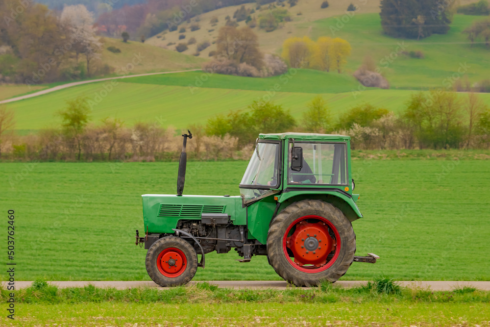 Fototapeta premium Oldtimer vintage agricultural tractor