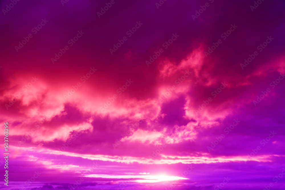 Amazing sky panorama. Colorful sunset in the evening sky. Meditative calmness and greatness. Great dramatic view. Mystical lighting. Clouds illuminated by the setting sun