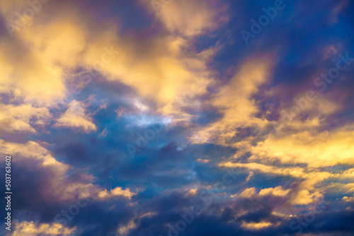 Meditative calmness and greatness. Amazing sky panorama. Mystical lighting. Colorful sunset in the evening sky. Great dramatic view. Clouds illuminated by the setting sun