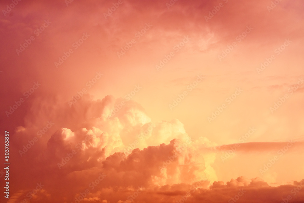 Clouds illuminated by the setting sun. Mystical lighting. Amazing sky panorama. Meditative calmness and greatness. Great dramatic view. Colorful sunset in the evening sky