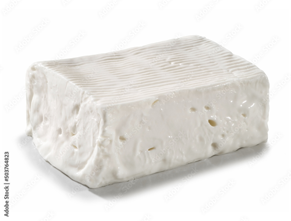 large portion of soft and spreadable fresh cheese, placed on a white surface
