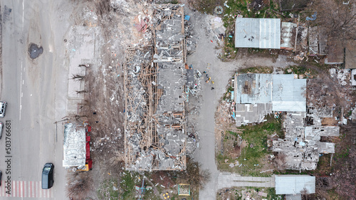 Borodyanka, a part of a residential building destroyed by a rocket. The roof of the house was destroyed by an explosion. Vertical view from a drone, aerial photography
