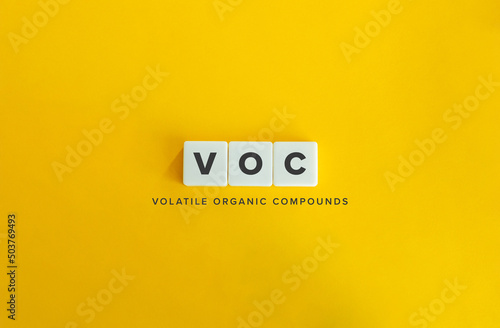 Volatile organic compounds (VOC) Banner. Letter Tiles on Yellow Background. Minimal Aesthetics. photo