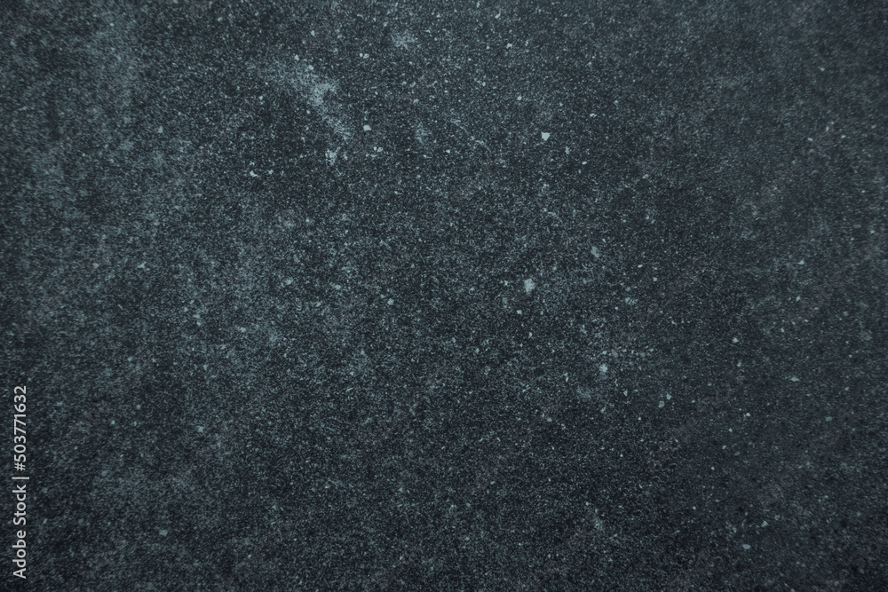 Obraz premium Dark worn blue and black stained surface background or texture