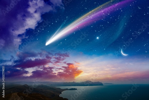 Amazing unreal background  giant colorful comet and rising crescent moon in starry sky over calm sea
