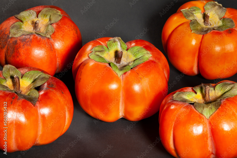 persimmon group on black background persimmon group on black background