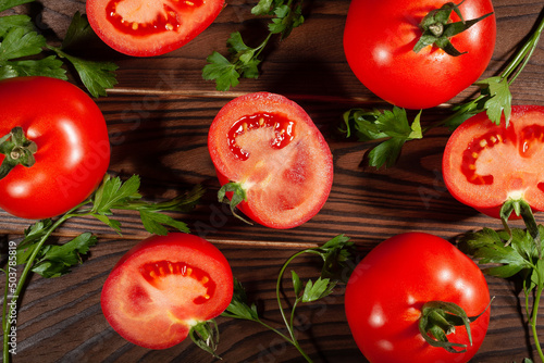 sliced tomato on wooden background top view