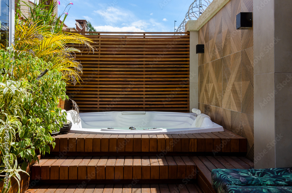 garden wooden deck with a jacuzzi at sunlight - obrazy, fototapety, plakaty 