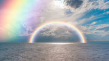 Beautiful landscape with turquoise sea with double sided rainbow at sunset