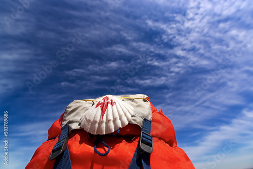 Way of St James , Camino de Santiago ,scallop shell on backpack with blue sky an Fototapet