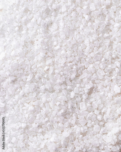 White coarse salt texture background. Top view