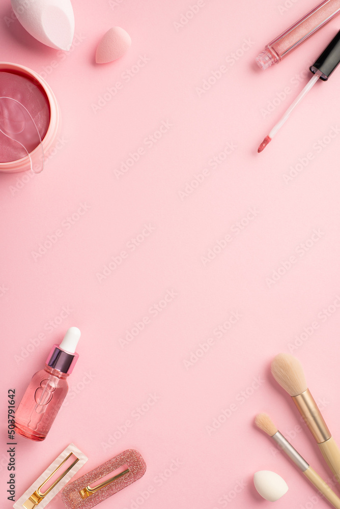 Top view vertical photo of beauty blenders pink eye patches with special spoon lip gloss glass dropper bottle makeup brushes and two stylish hairpins on pastel pink background with blank space Top view vertical photo of beauty blenders pink eye patches with special spoon lip gloss glass dropper bottle makeup brushes and two stylish hairpins on pastel pink background with blank space