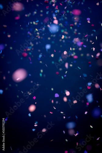 Dark blue background with confetti