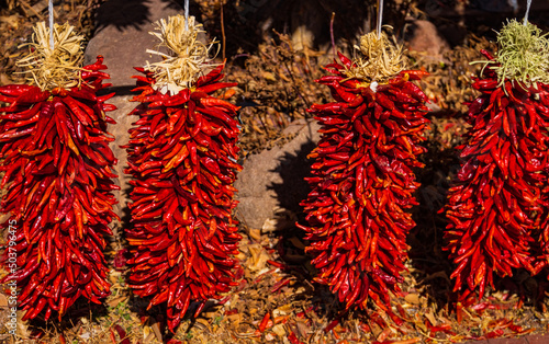red pepper ristras on display for sale 
 photo