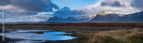 View during auto trip in West Iceland highlands  Snaefellsnes peninsula  Snaefellsjokull National Park. Spectacular volcanic tundra landscape with mountains  craters  lakes  gravel roads.