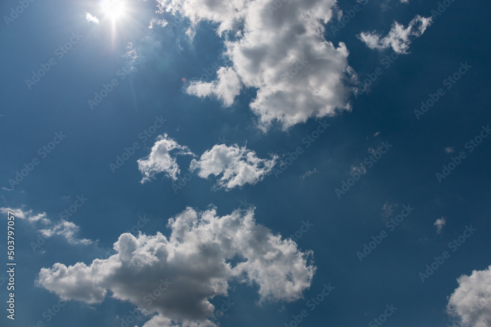 Bright beautiful white clouds against the midday blue sky. Bright beautiful white clouds against the midday blue sky.