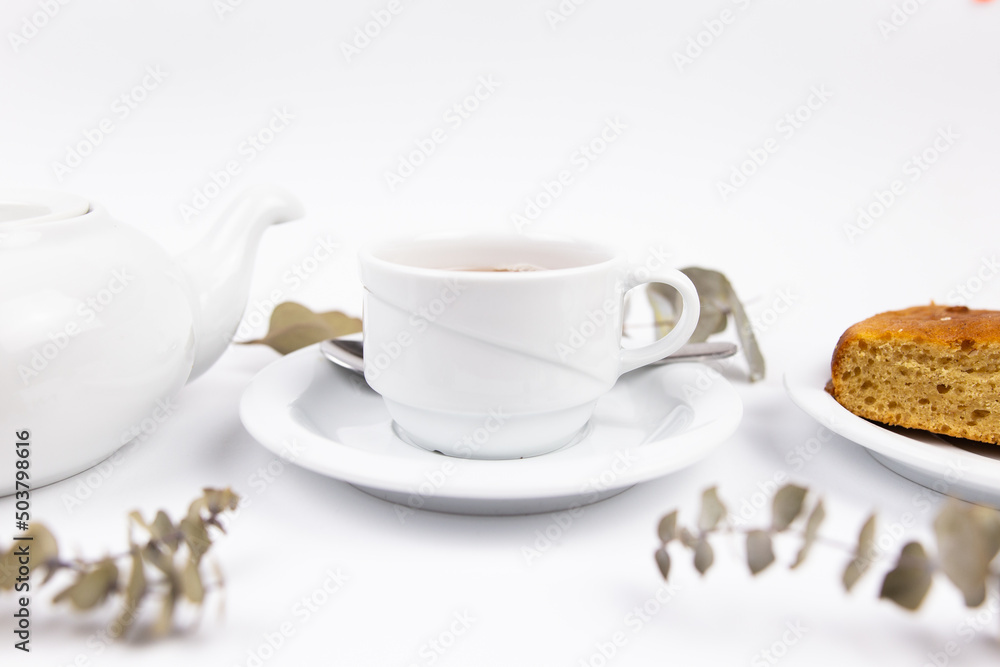 white tea set with teapot tea and saucers and pie for breakfast white tea set with teapot tea and saucers and pie for breakfast