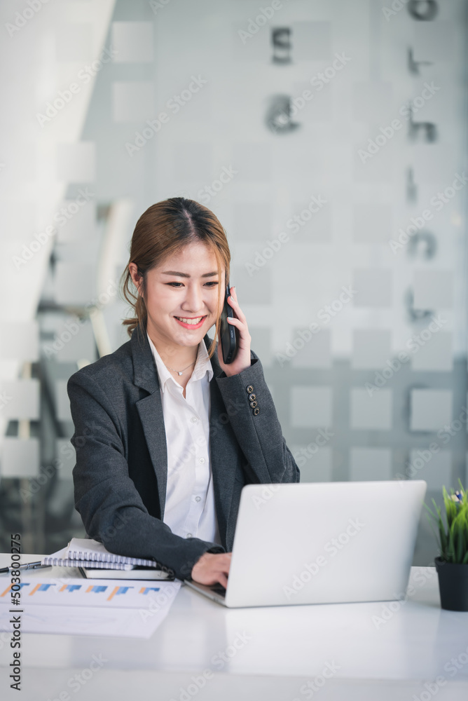 Portrait of a business woman working on a tablet computer in a modern office. Make an account analysis report. real estate investment information financial and tax system concepts Portrait of a business woman working on a tablet computer in a modern office. Make an account analysis report. real estate investment information financial and tax system concepts